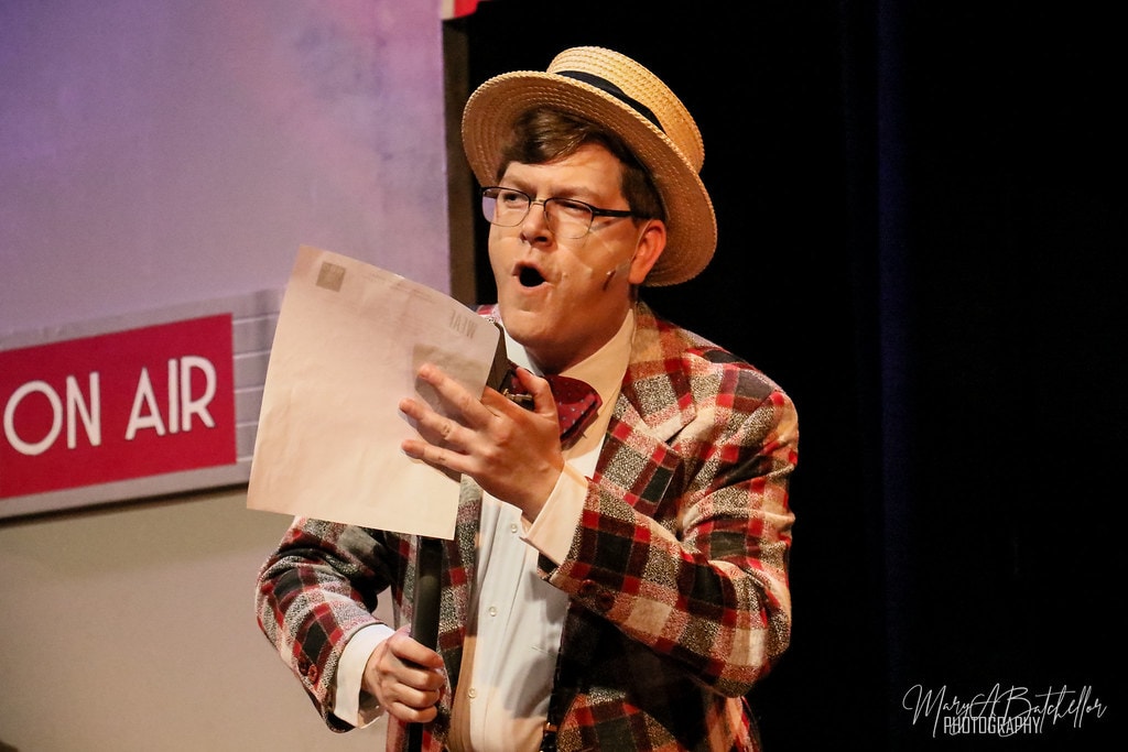 Annie — Bert Healy in a plaid jacket and straw boater hat performs a solo