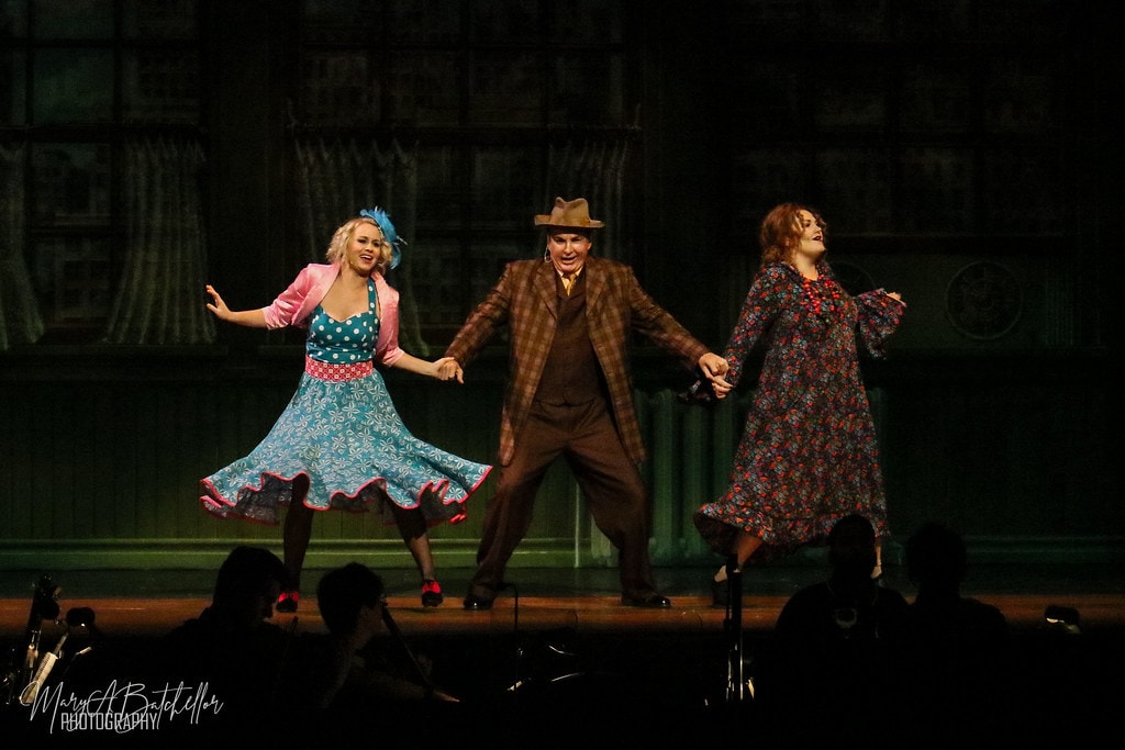 Annie — Lily St. Regis, Rooster, and Miss Hannigan hold hands and kick in a joyful trio number