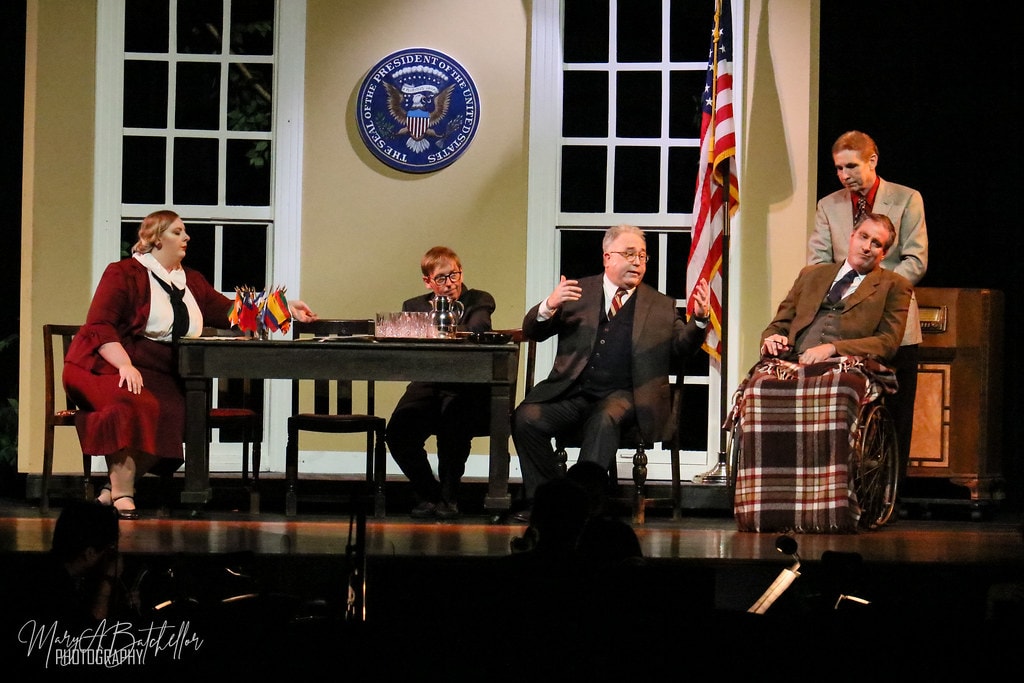 Annie — five adults perform the White House scene before the Presidential Seal with the American flag