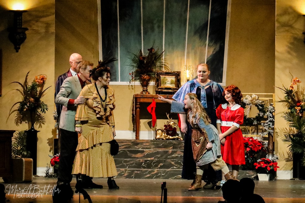 Annie — Rooster and Miss Hannigan confront Grace Farrell as Annie looks on in the Warbucks mansion