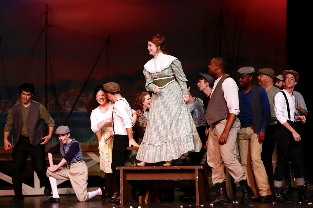 Julie Jordan standing on bench with ensemble — Carousel