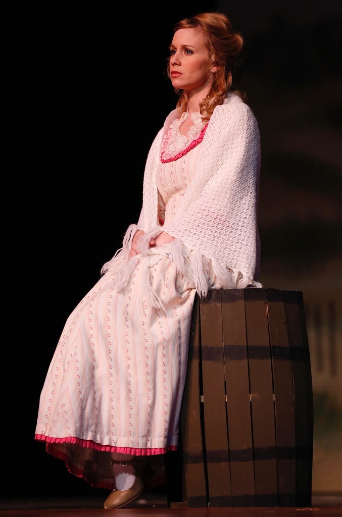 Julie Jordan solo portrait sitting on barrel — Carousel