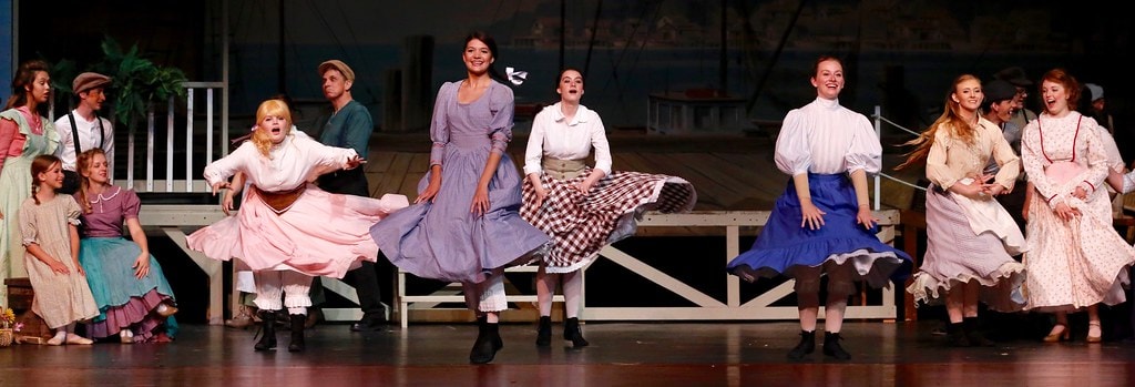 Women skirt-swirling ensemble dance number — Carousel