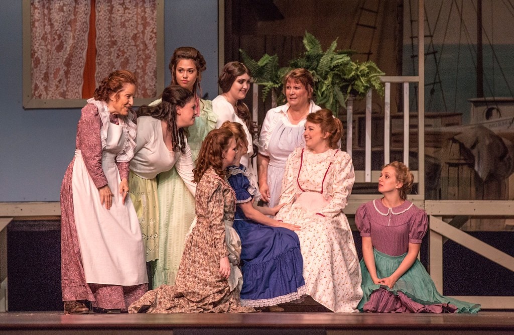 Women gathered at Nettie's porch comforting Julie — Carousel
