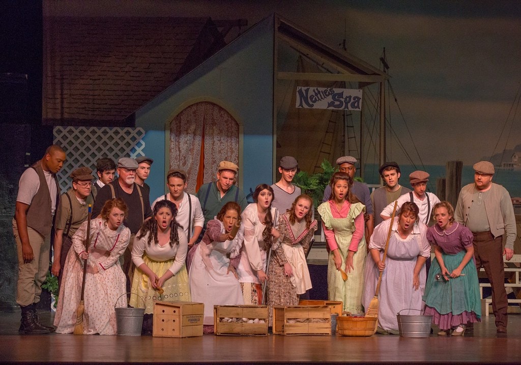Full Nettie's Spa ensemble singing with buckets and crates — Carousel