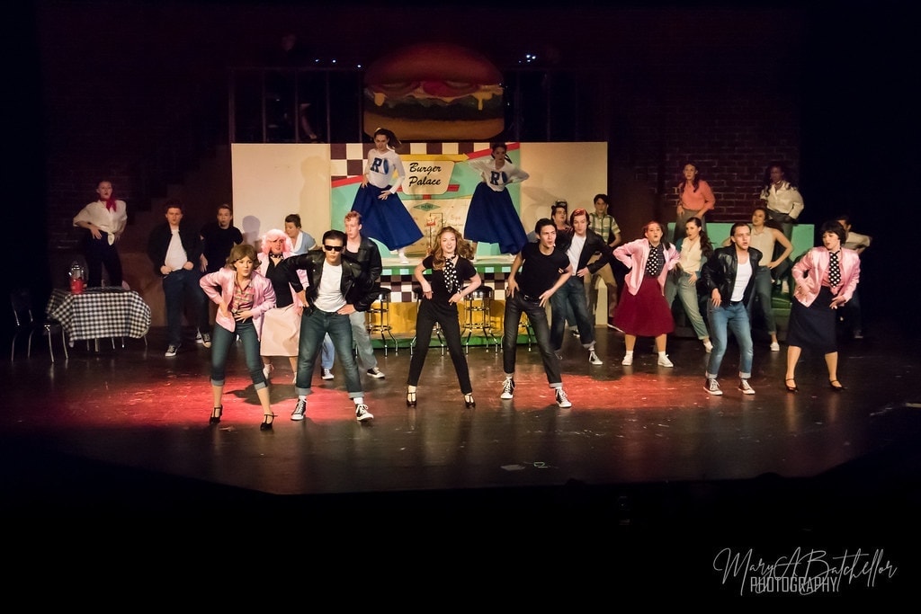 Grease — full cast energetic dance number at Burger Palace