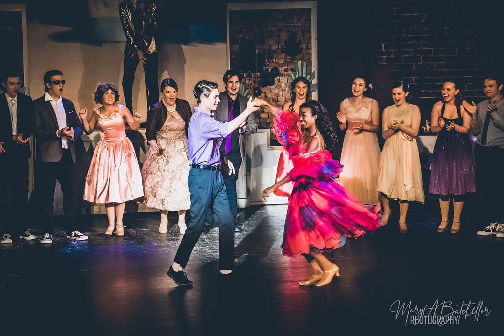 Grease — couple dancing together at beach party