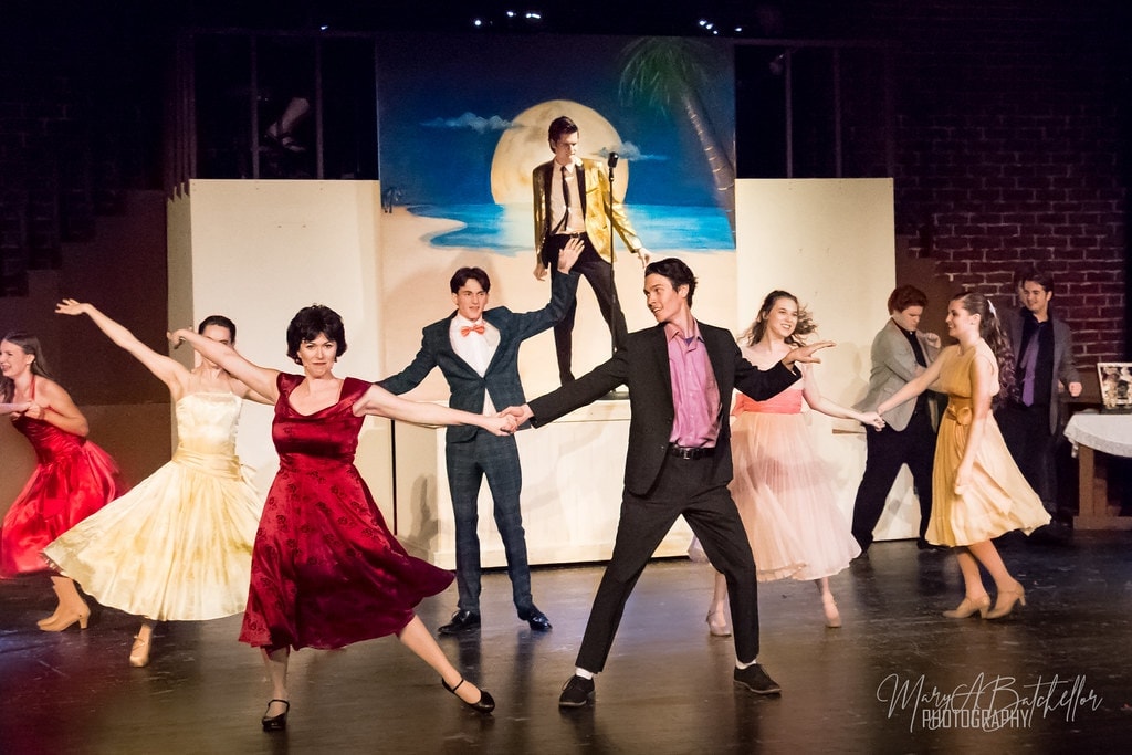 Grease — prom scene with couples dancing as Teen Angel sings above