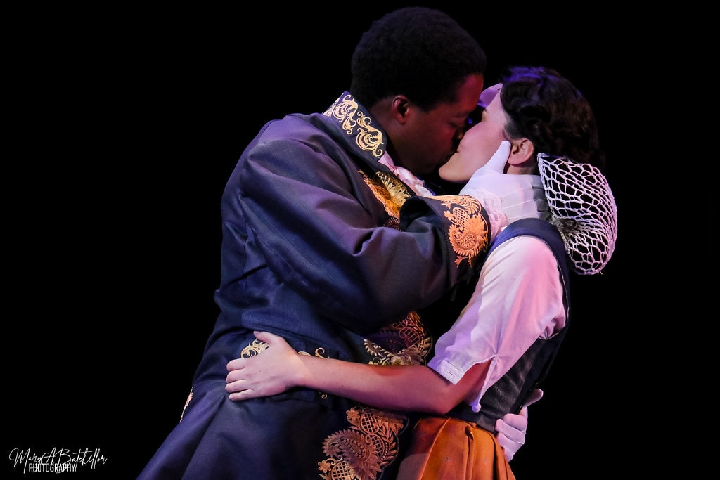 Into the Woods — Rapunzel's Prince and Cinderella share a close romantic moment in the dark forest