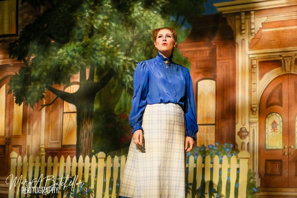 The Music Man — Marian sings a solo before the painted Victorian house backdrop