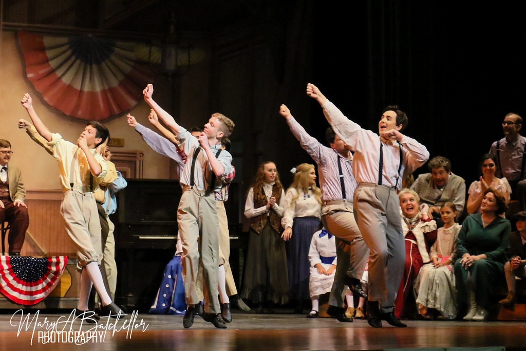 The Music Man — three young men in suspenders leap in a dynamic dance number