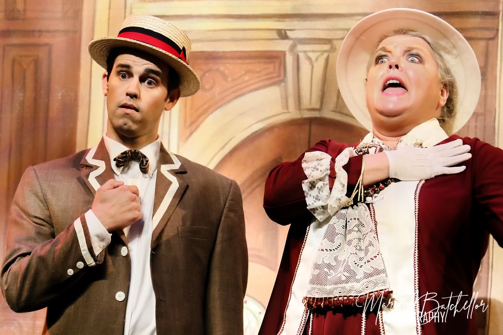 The Music Man — Harold Hill reacts with wide eyes beside Eulalie