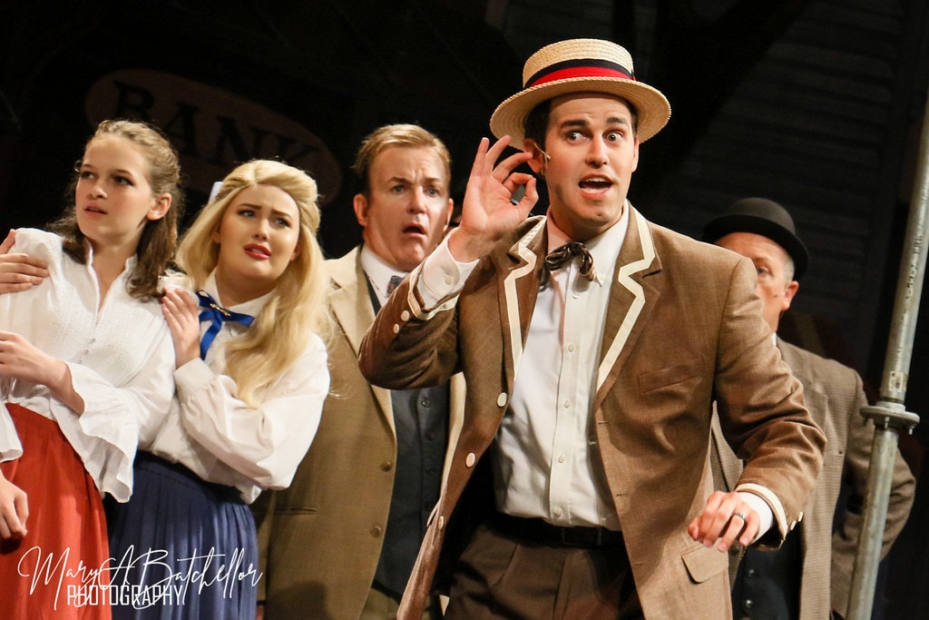 The Music Man — Harold Hill in his straw boater hat gestures expressively