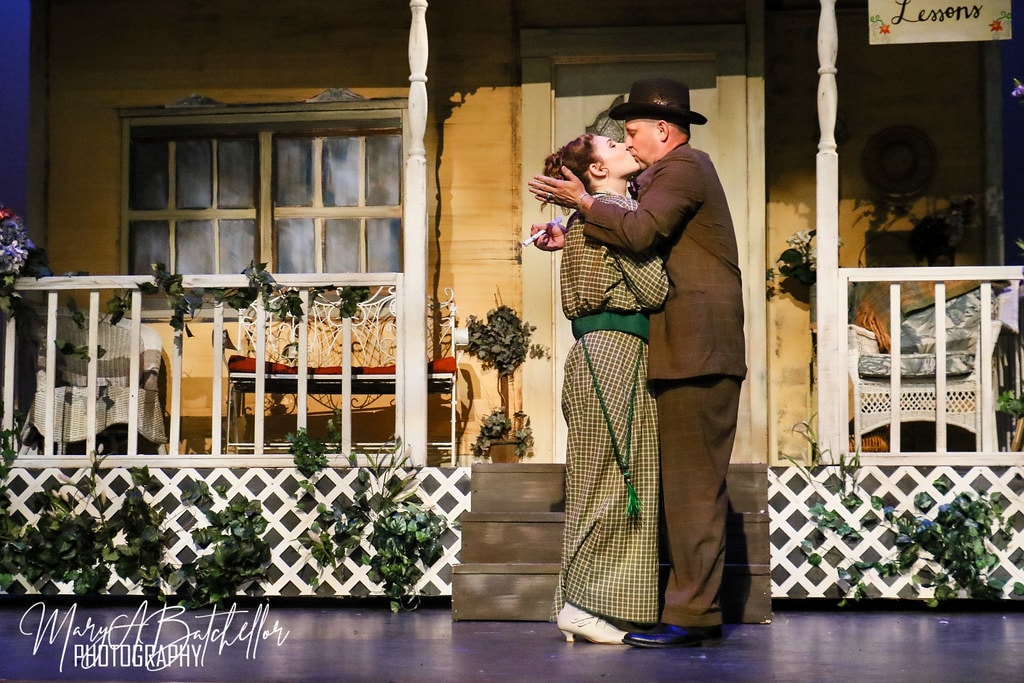 The Music Man — Harold Hill and Marian share a kiss on the Paroo porch