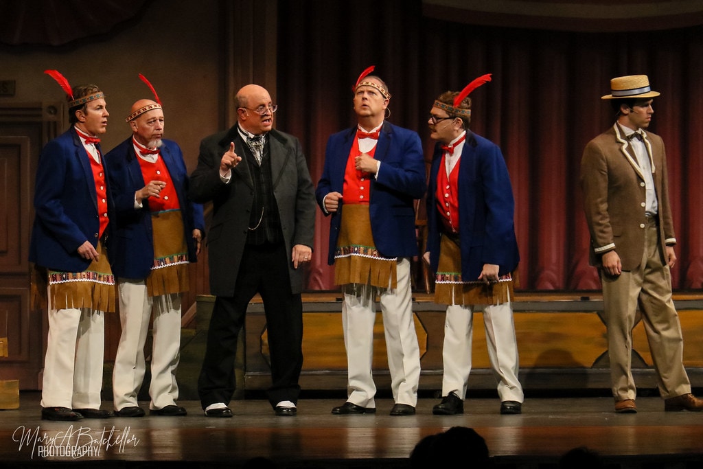 The Music Man — Mayor Shinn points at four men in blue jackets and red vests