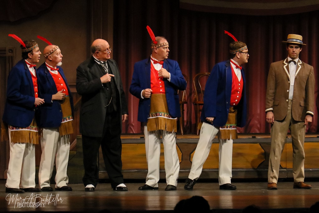 The Music Man — Mayor Shinn points at four men in blue jackets and red vests — second angle