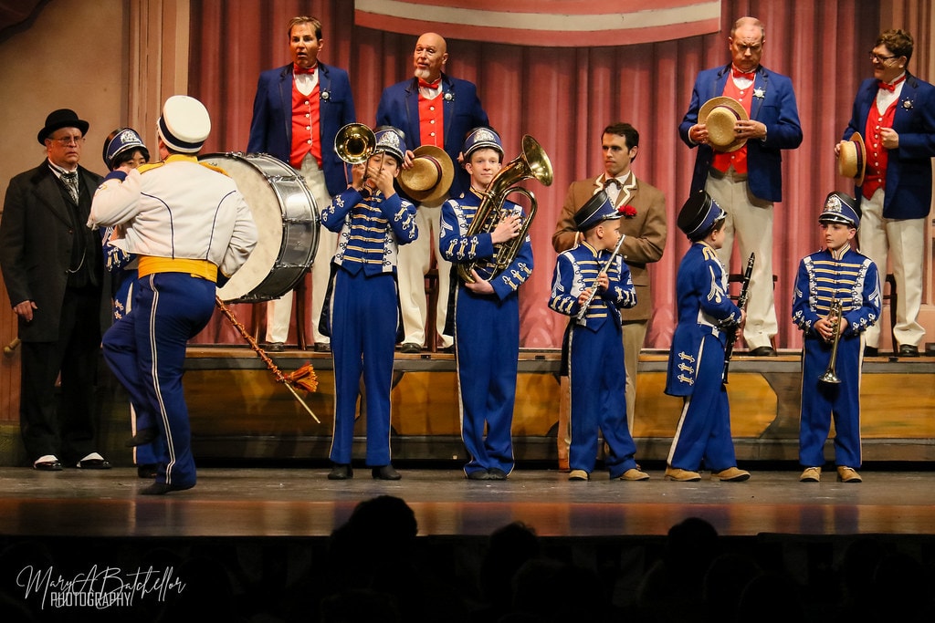 The Music Man — the River City Boys Band in blue marching uniforms plays brass and percussion