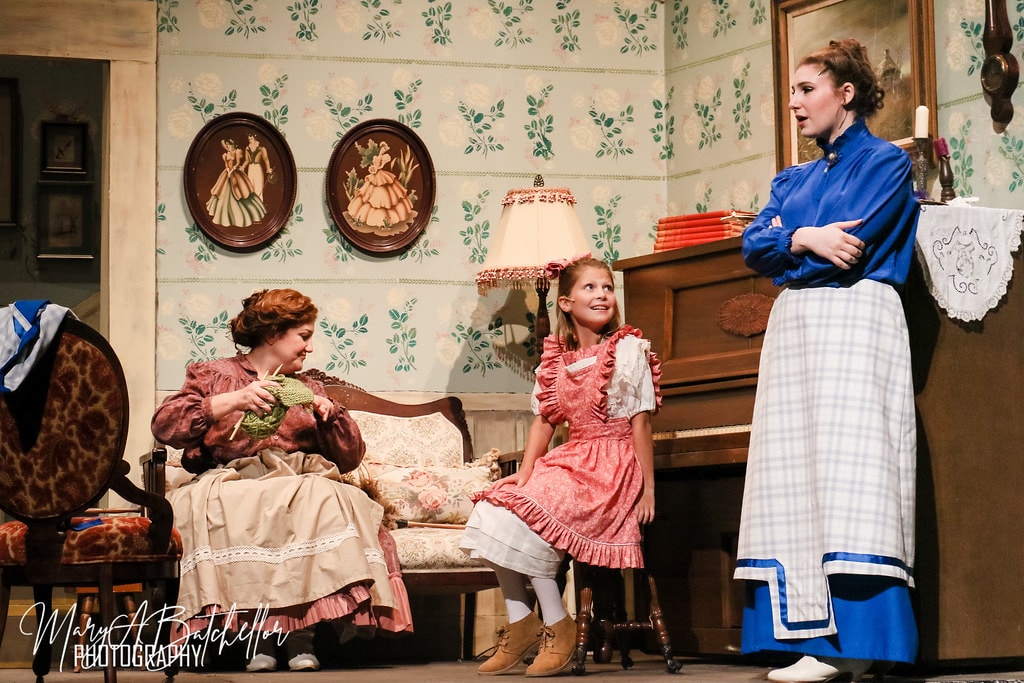 The Music Man — Mrs. Paroo knitting, Amaryllis at the piano, and Marian in the Paroo parlor