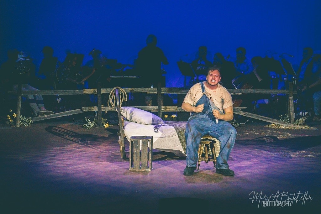 Oklahoma! — Jud Fry seated by bed with orchestra