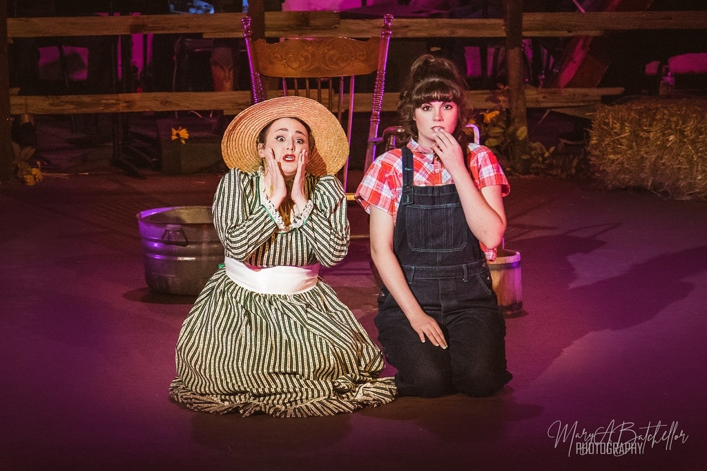 Oklahoma! — Ado Annie and Laurey sharing a moment on crate