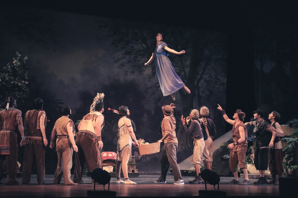 Peter Pan — Wendy floats above the full cast of Lost Boys and Tiger Lily's tribe in Neverland