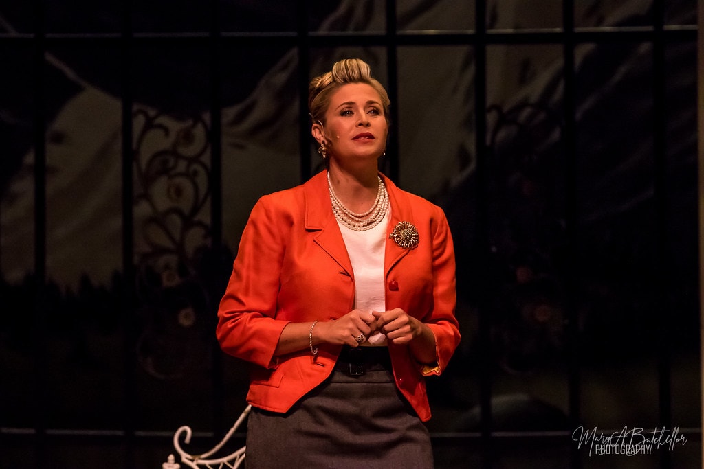 The Sound of Music — Elsa Schraeder in red blazer singing a solo