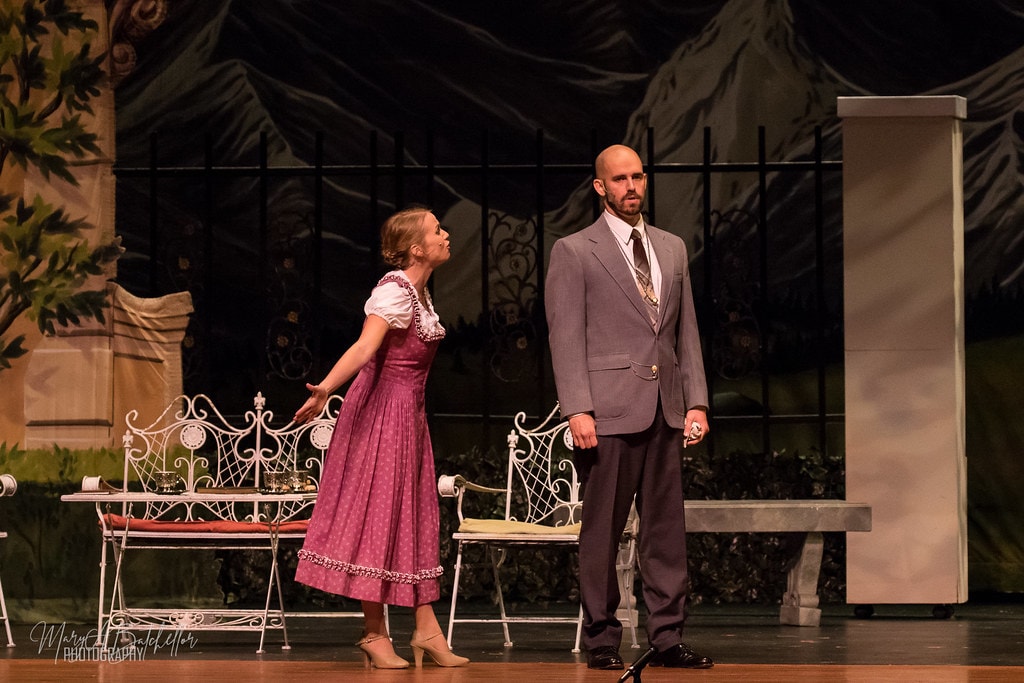 The Sound of Music — Maria in pink dirndl pleading with Captain von Trapp