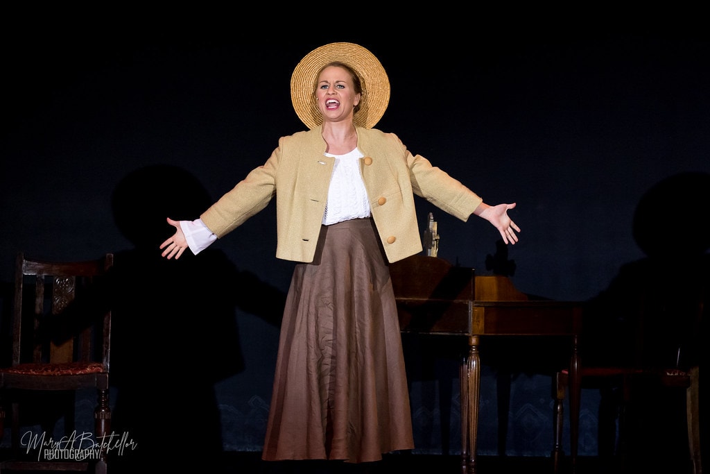 The Sound of Music — Maria in straw hat singing with arms outstretched