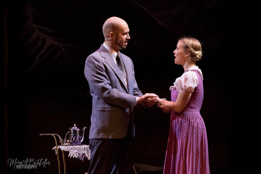 The Sound of Music — Captain von Trapp and Maria holding hands face to face