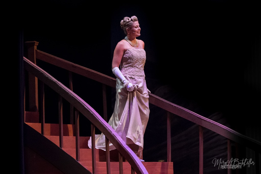 The Sound of Music — Elsa Schraeder in silver strapless gown descending the staircase