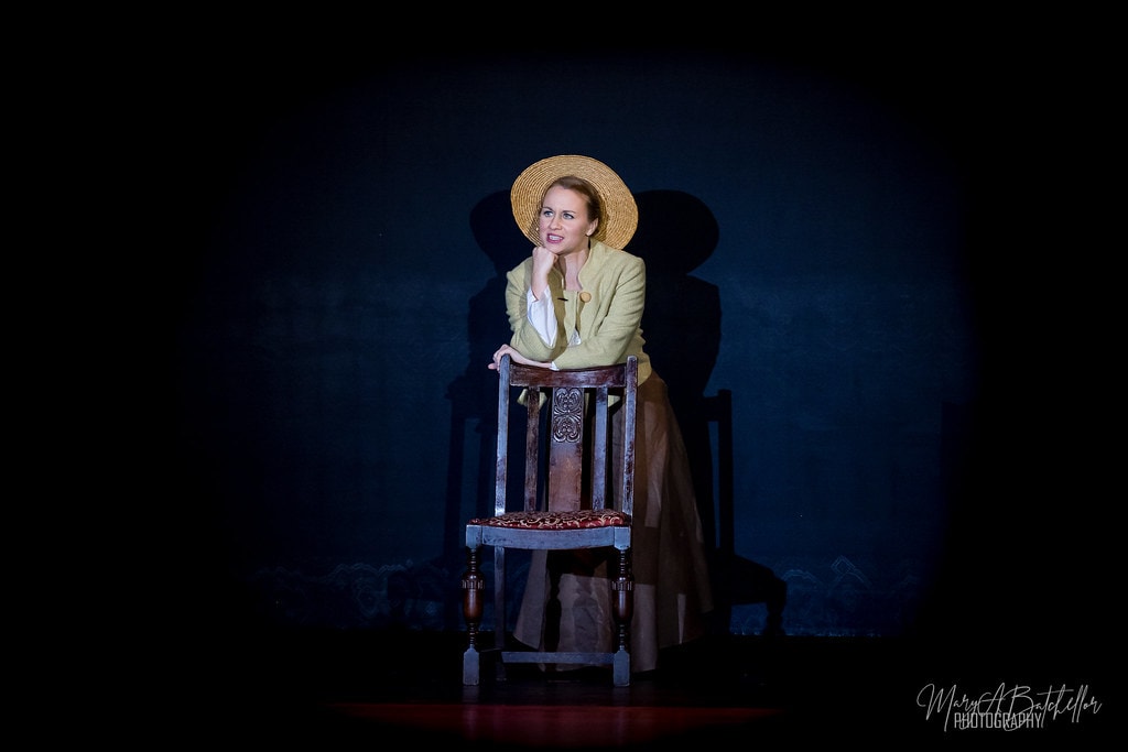 The Sound of Music — Maria in straw hat leaning pensively on an ornate chair
