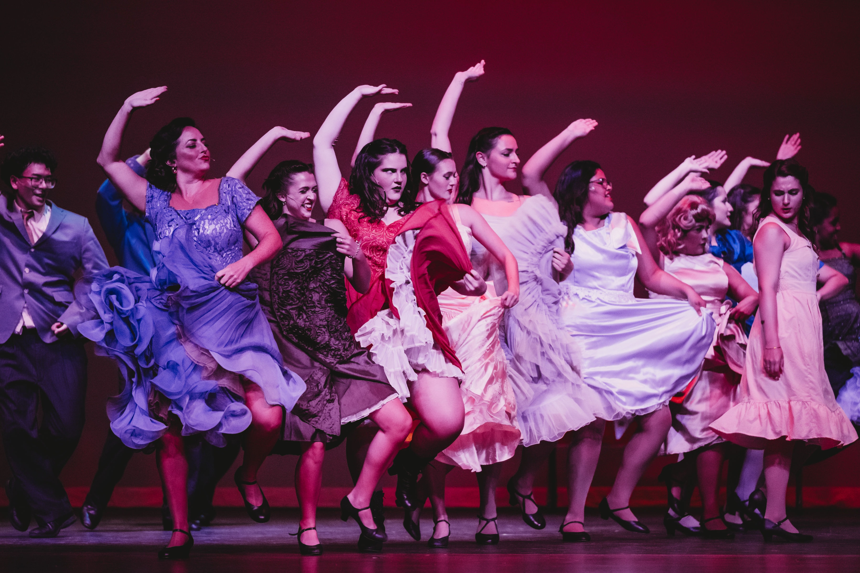 West Side Story 2026 - Shark girls dancing in colorful dresses with arms raised